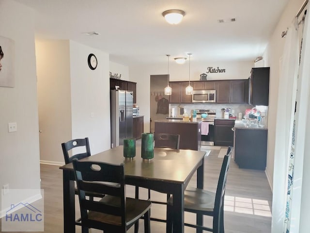 dining room featuring light hardwood / wood-style flooring