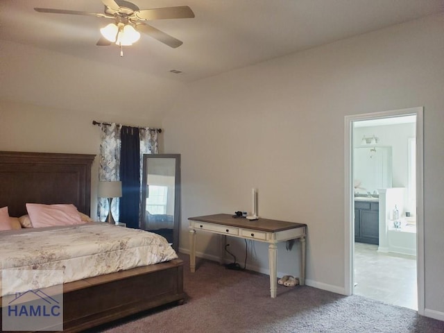 bedroom with ensuite bath, vaulted ceiling, ceiling fan, and carpet flooring