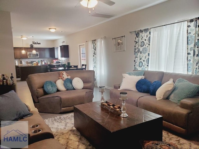 living room with ceiling fan