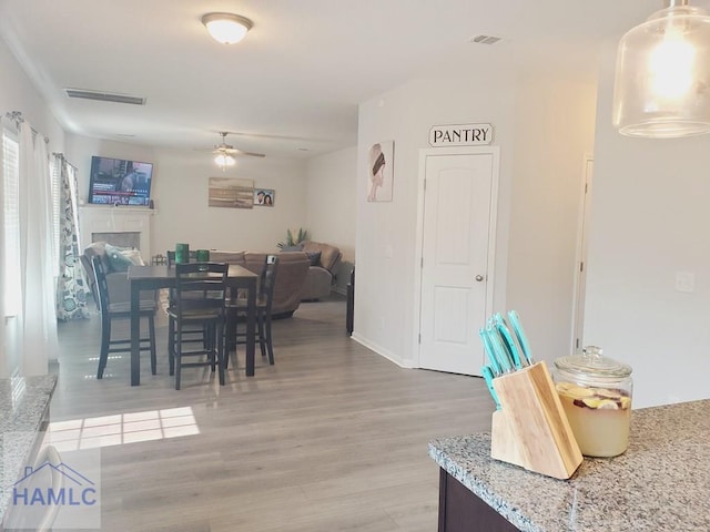 dining room featuring hardwood / wood-style flooring and ceiling fan