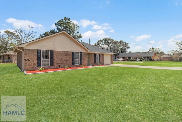 ranch-style home featuring driveway, a garage, a front lawn, and brick siding