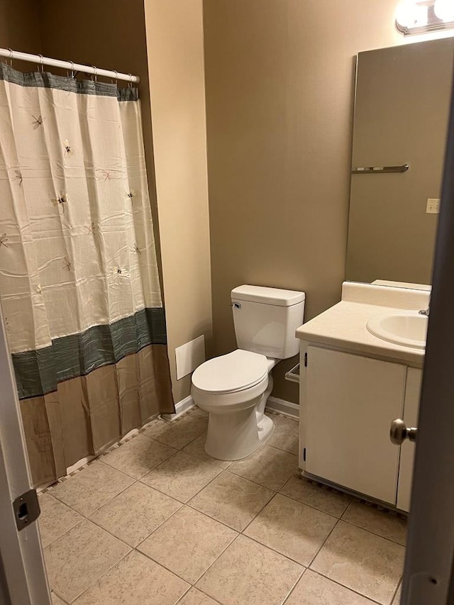 bathroom featuring tile patterned flooring, vanity, toilet, and a shower with shower curtain