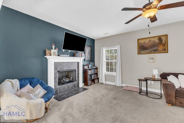 732 Waterlily Ct, Hinesville, GA 31313 - living room featuring baseboards, a ceiling fan, a tile fireplace, and carpet