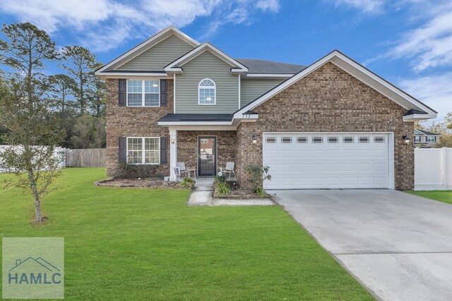 732 Waterlily Ct, Hinesville, GA 31313 - view of front of house featuring concrete driveway, an attached garage, fence, brick siding, and a front lawn