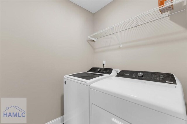 732 Waterlily Ct, Hinesville, GA 31313 - laundry area with washer and dryer, laundry area, and baseboards