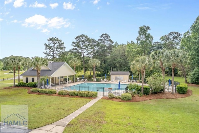 301 Marsh View Dr, Richmond Hill, GA 31324 - community pool featuring a patio area and view of wooded area