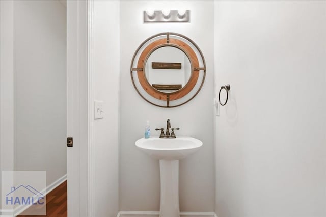 301 Marsh View Dr, Richmond Hill, GA 31324 - bathroom featuring a sink and baseboards