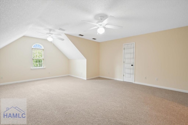 301 Marsh View Dr, Richmond Hill, GA 31324 - bonus room with a ceiling fan, light carpet, a textured ceiling, and vaulted ceiling