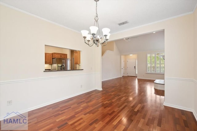 301 Marsh View Dr, Richmond Hill, GA 31324 - unfurnished dining area with a chandelier, ornamental molding, and dark wood-style floors