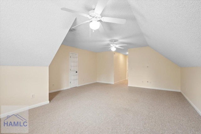 301 Marsh View Dr, Richmond Hill, GA 31324 - bonus room with vaulted ceiling, a textured ceiling, light colored carpet, and a ceiling fan