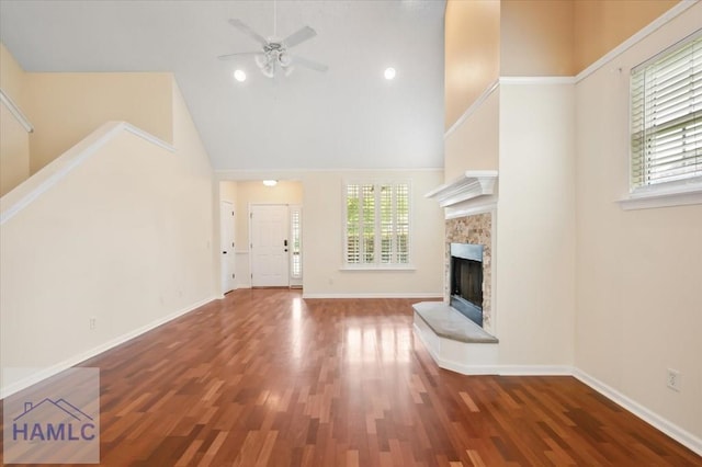 301 Marsh View Dr, Richmond Hill, GA 31324 - unfurnished living room with ceiling fan, wood finished floors, a fireplace, and high vaulted ceiling