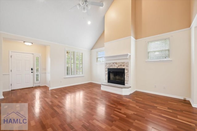 301 Marsh View Dr, Richmond Hill, GA 31324 - unfurnished living room featuring high vaulted ceiling, ceiling fan, wood finished floors, and a stone fireplace