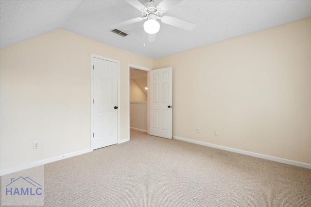 301 Marsh View Dr, Richmond Hill, GA 31324 - unfurnished bedroom with carpet, lofted ceiling, a textured ceiling, and a ceiling fan