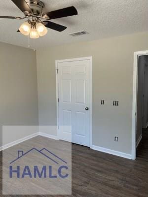 363 Sea Island Rd, Jesup, GA 31545 - empty room with a ceiling fan, dark wood-type flooring, and a textured ceiling