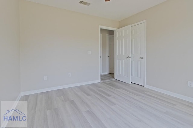 52 Pheasant Way, Hinesville, GA 31313 - unfurnished bedroom featuring baseboards, a closet, light wood finished floors, and visible vents