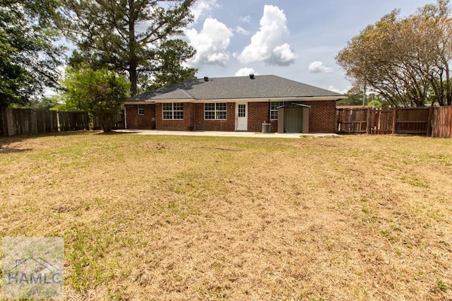 52 Pheasant Way, Hinesville, GA 31313 - rear view of property with a lawn, a patio, and a fenced backyard