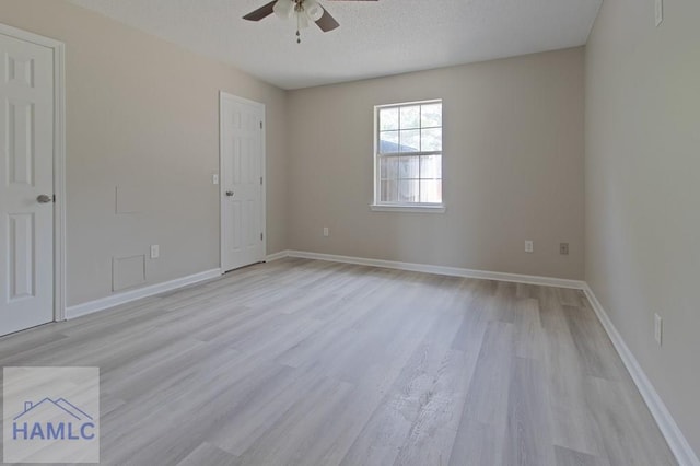 52 Pheasant Way, Hinesville, GA 31313 - spare room featuring a ceiling fan, baseboards, light wood finished floors, and a textured ceiling
