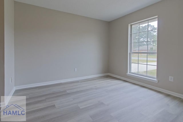 52 Pheasant Way, Hinesville, GA 31313 - empty room with baseboards, a wealth of natural light, and light wood-style flooring