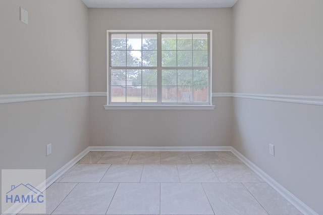 52 Pheasant Way, Hinesville, GA 31313 - empty room with baseboards and light tile patterned floors