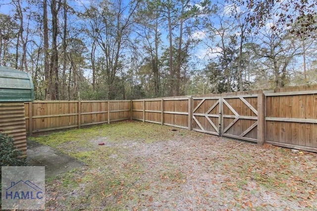 view of yard with a gate and fence