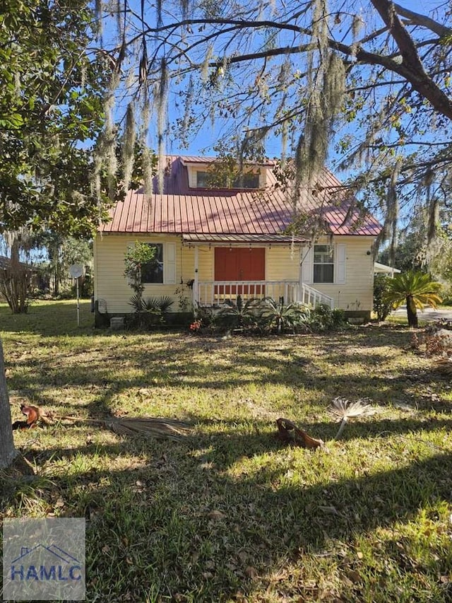 view of property exterior with a porch and a yard