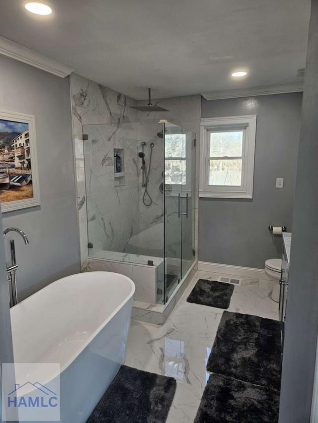 full bathroom featuring vanity, ceiling fan, toilet, ornamental molding, and shower with separate bathtub