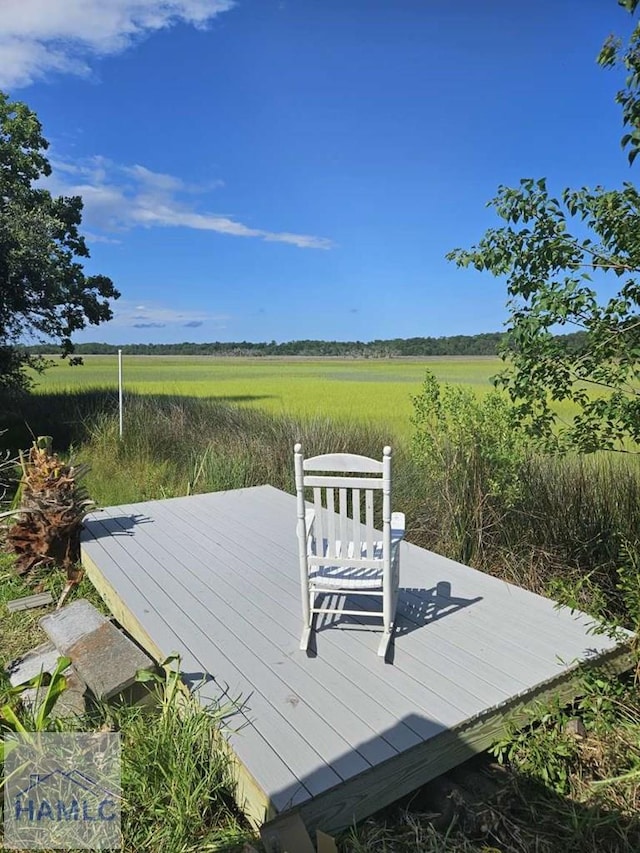 wooden deck featuring a rural view