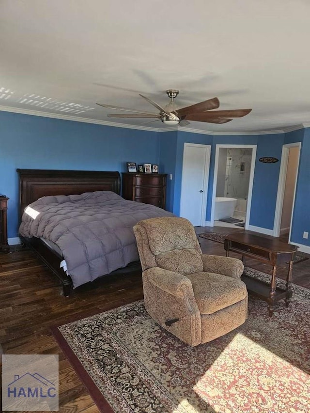 bedroom featuring ensuite bathroom, crown molding, ceiling fan, and dark wood-type flooring