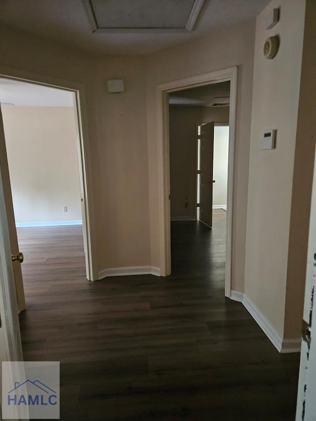 hall with dark hardwood / wood-style floors