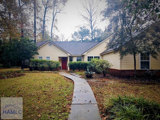 single story home with a front yard