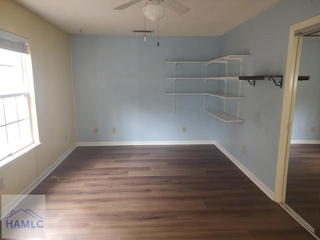 unfurnished room with ceiling fan and hardwood / wood-style floors