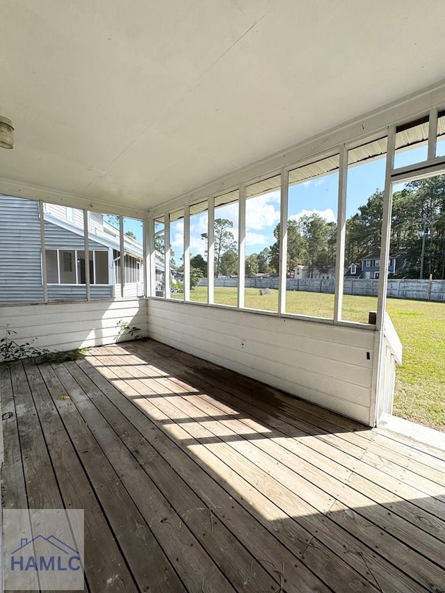 unfurnished sunroom featuring a healthy amount of sunlight