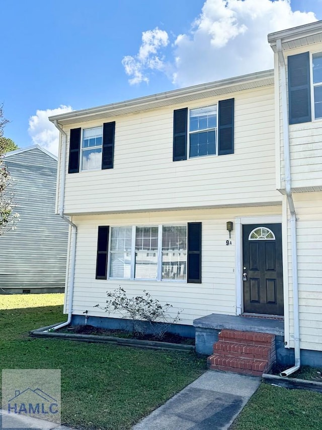 view of front of property with a front lawn