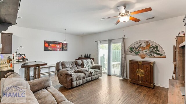25 Walker Ct, Richmond Hill, GA 31324 - living area with dark wood-type flooring, ceiling fan, and visible vents