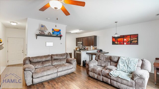25 Walker Ct, Richmond Hill, GA 31324 - living area with ceiling fan and wood finished floors
