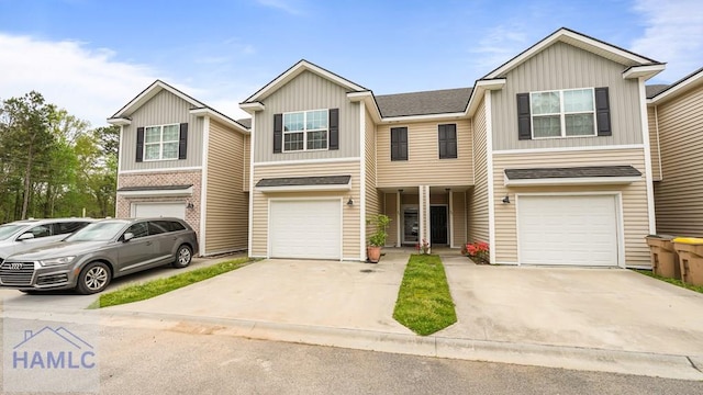 25 Walker Ct, Richmond Hill, GA 31324 - townhome / multi-family property with driveway, a garage, and board and batten siding