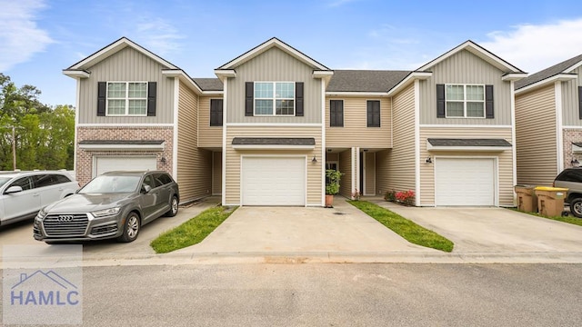 25 Walker Ct, Richmond Hill, GA 31324 - townhome / multi-family property featuring board and batten siding, driveway, and a garage