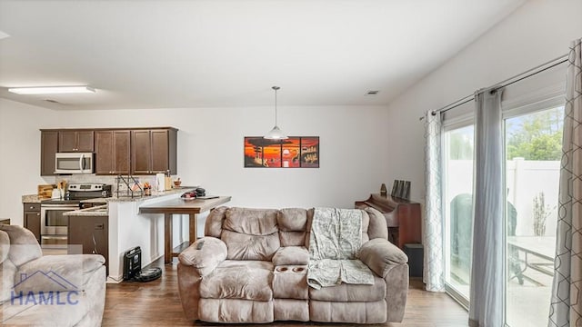 25 Walker Ct, Richmond Hill, GA 31324 - living area featuring visible vents and wood finished floors