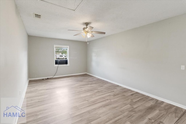 1055 Phantom Ter, Hinesville, GA 31313 - unfurnished room featuring light wood-style floors, ceiling fan, a textured ceiling, and baseboards
