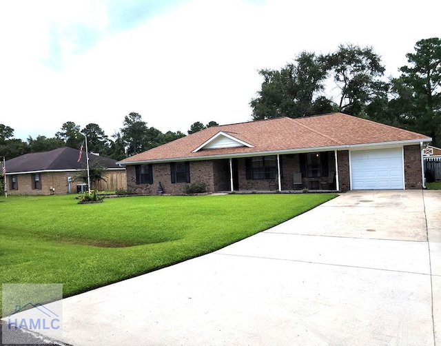 ranch-style house with a garage and a front yard