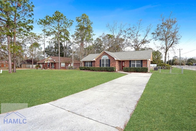 ranch-style home with a front lawn