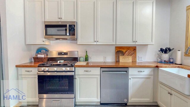 26 Cason Rd, Pembroke, GA 31321 - kitchen featuring appliances with stainless steel finishes, white cabinets, and butcher block countertops