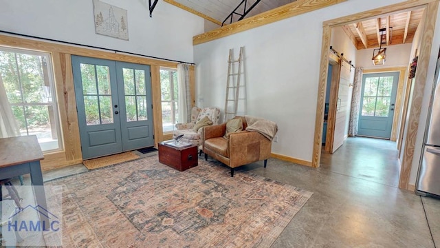 26 Cason Rd, Pembroke, GA 31321 - entryway with a wooden ceiling with exposed beams, french doors, finished concrete flooring, and a barn door