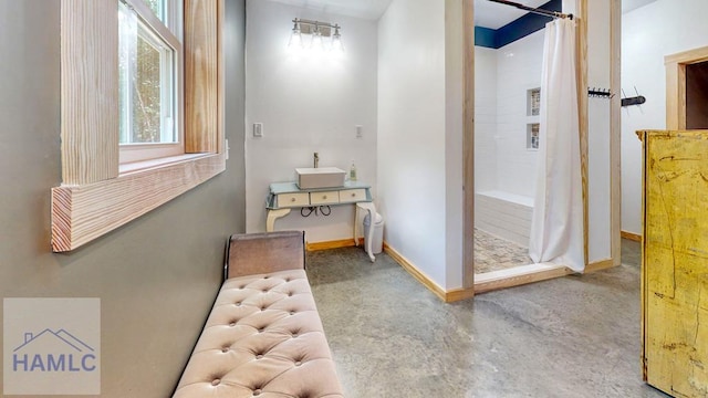 26 Cason Rd, Pembroke, GA 31321 - hall featuring plenty of natural light and concrete flooring