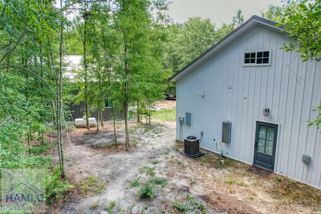 26 Cason Rd, Pembroke, GA 31321 - view of side of home with board and batten siding and a central AC unit