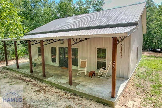 26 Cason Rd, Pembroke, GA 31321 - back of property featuring a patio area and a metal roof