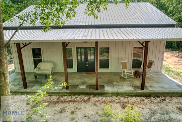26 Cason Rd, Pembroke, GA 31321 - rear view of property featuring french doors, a patio, and a metal roof
