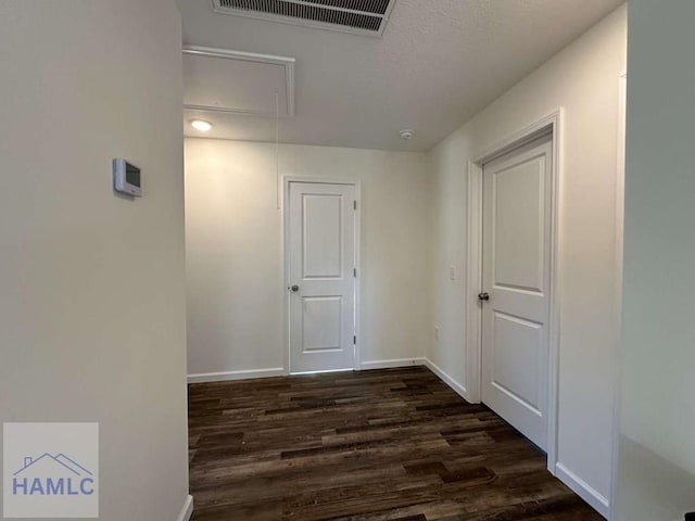 hall featuring dark wood-type flooring