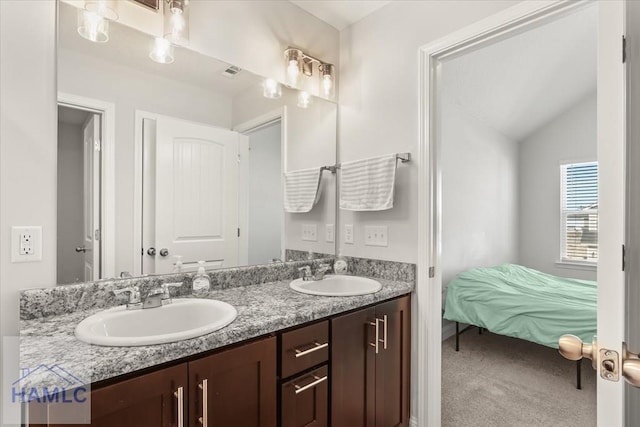 full bath with a sink, visible vents, double vanity, and vaulted ceiling