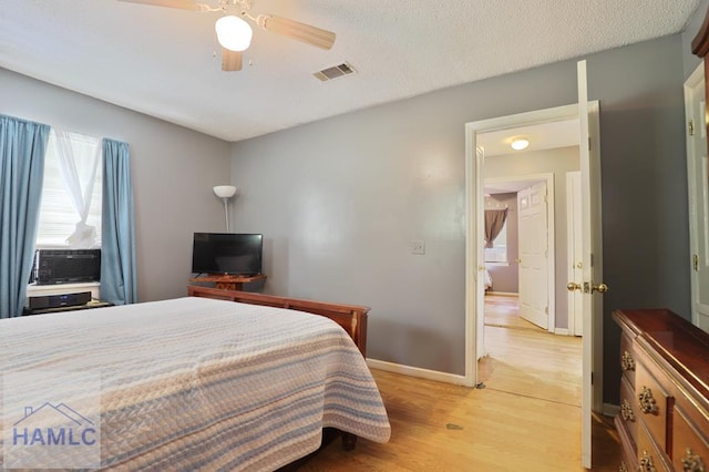 455 N Mahogany St, Jesup, GA 31546 - bedroom featuring cooling unit, light wood finished floors, and a ceiling fan